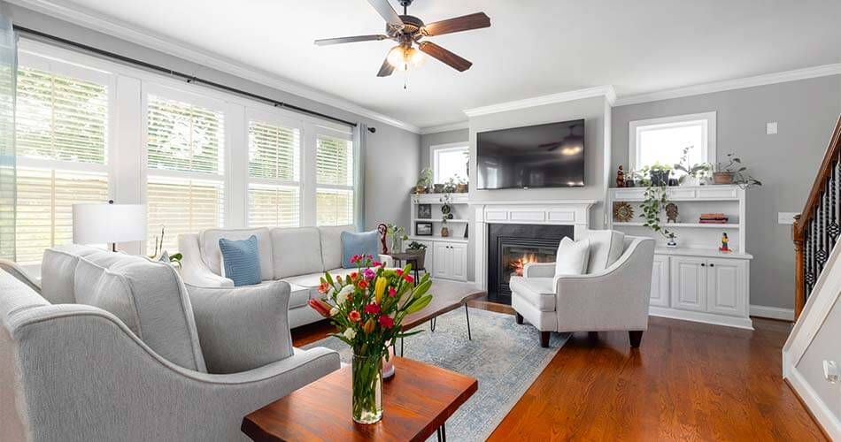 Living room with seating and wooden floors in Sarasota, Florida.